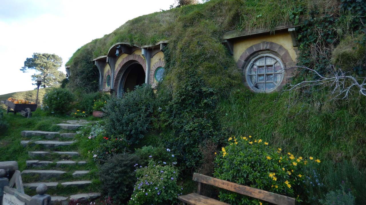 Lush green covered houses in Hobbitown, New Zealand