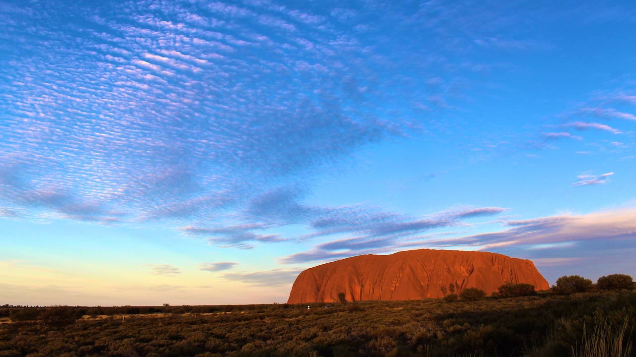 Uluru, in the heart of the Northern Territory of Australia at dusk