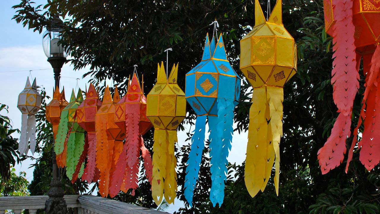 Colorful decorative hangings strewn outside in Chiang Mai