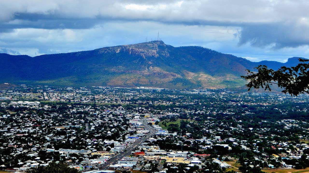 A an aerial view of Townsville's sprawling landscape and mountain range