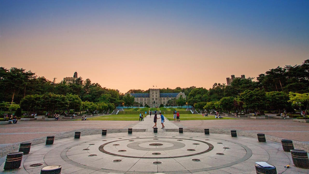 An outdoor, circular area on Korea University's campus at dusk