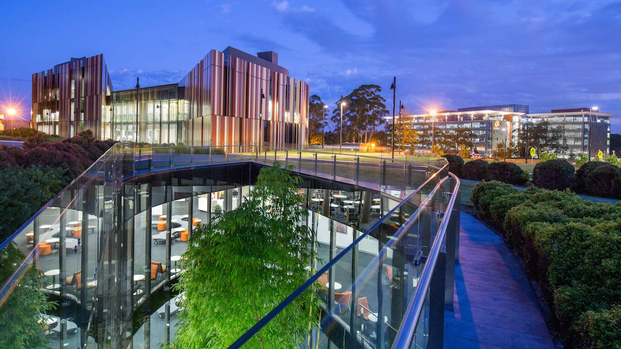 The exterior of the rear of Macquarie University's library at sunset