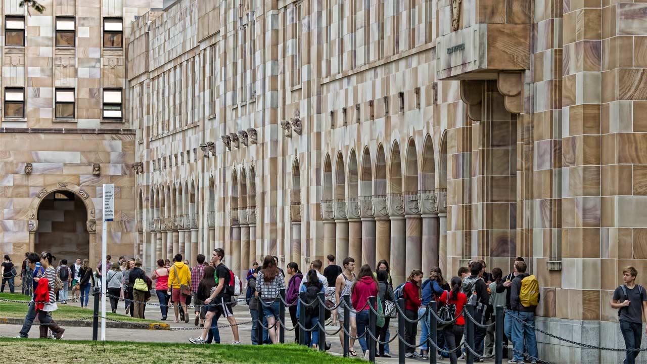 Students use the walkways on UQ's campus to travel between classes